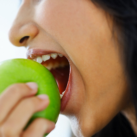 Woman Eating Apple